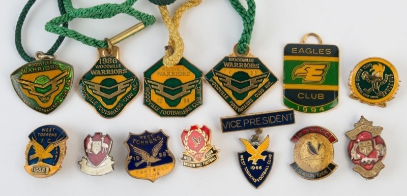 A range of football club badges and fobs, comprising NORTH ADELAIDE 1958 and 1963; WEST TORRENS 1958, 1966 Vice President, 1988 & 1994; WOODVILLE 1980, 1984-86 & 1988; and WEST BROKEN HILL 1966 and 1972, (13 items).