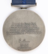 JAMES HIRD'S RUNNERS-UP MEDAL, from the 2001 Grand Final; the medal showing two players with the MCG in the background, and text "AFL Grand Final, 2001, Runners-up/ AFL". Reverse has text, "To reach the Grand Final, the ultimate event in a long, arduous,