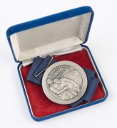 JAMES HIRD'S RUNNERS-UP MEDAL, from the 2001 Grand Final; the medal showing two players with the MCG in the background, and text "AFL Grand Final, 2001, Runners-up/ AFL". Reverse has text, "To reach the Grand Final, the ultimate event in a long, arduous, - 2