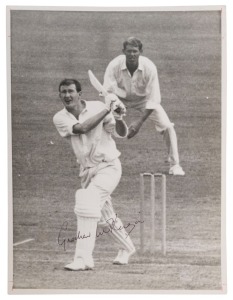 GRAHAM MCKENZIE COLLECTION - 1963-64 AUSTRALIA v SOUTH AFRICA TEST SERIES: Graham McKenzie signed press photograph showing him hitting a huge six to the top of the Member's Pavilion during the Third Test at the SCG (Jan.10-15, 1964), McKenzie going to mak