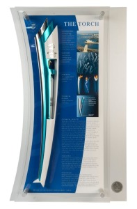SYDNEY 2000 OLYMPIC TORCH, aluminium and stainless steel, in perspex display case with details of the Torch's inspiration, design & technical aspects, limited edition 423/2000 created to replicate the torches carried by the Torchbearers, overall 54x89cm. With CoA.