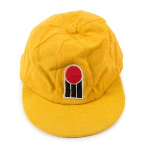 GRAHAM MCKENZIE COLLECTION - 1977-1979 WORLD SERIES CRICKET: Graham McKenzie's World Series Cricket Cap in yellow wool, with the WCS logo on the front, signed on the underside by McKenzie; in very good condition.