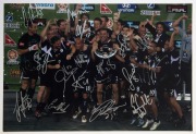 PLAYER SIGNED COLOUR PRINTS: comprising Melbourne Victory 2006-07 Premiership team photo, signed by whole team (16 signatures), Australian players Brett Emmerton & Mark Schwarzer signed action photos, these all 45x30cm; also magazine cut-out (22x29cm) sig