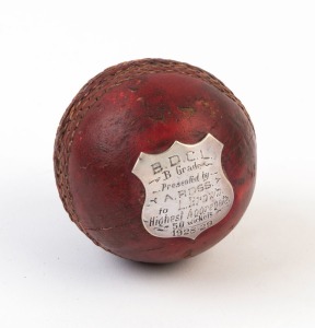 TROPHY CRICKET BALL: with sterling silver shield affixed and engraved 'B.D.C.L./B Grade/Presented by/A.Ross/to L.Brown/Highest Aggregate/50 Wickets/1928-29".