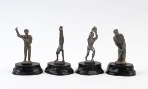 Group of four small metal statues, circa 1920s, each mounted on a wooden base: a footballer, a cricketer, a gymnast and a dart-thrower. Each approx 11cm high. (4).