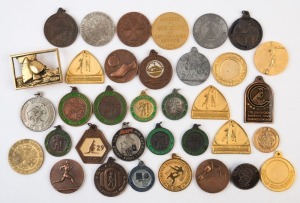 SPORTING MEDALLIONS: 1970s-80s era accumulation with many sports/activities represented including athletics incl. Collingwood Harriers Club, basketball, fencing, netball, rollerskating, soccer, taekwondo; a few non-sports related. (30+)