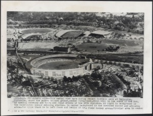 MELBOURNE OLYMPICS - MELBOURNE CRICKET GROUND: Press Agency photographs one dated July 1956 showing construction work to the Main Stand, to increase spectator capacity to 110,000 for the opening ceremony held on November 22, a second taken in September showing a football game in progress with the construction work apparently completed, the third photo showing a closer-up image of the ground circa late 1956. (3 items)
