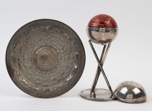 GRAHAM MCKENZIE COLLECTION - 1964 TOUR OF ENGLAND, INDIA & PAKISTAN: silver plate trophy containing cricket ball, presented to Graham McKenzie for taking the highest number of wickets (10) in the 1964 (Oct.2 to 7) 1st Test held at Madras; also decorated metal salver presented to McKenzie to commemorate a one day stopover match between Australia & Ceylon (15th Apr. 1964), whilst the Australian team was en route to England. (2 items)