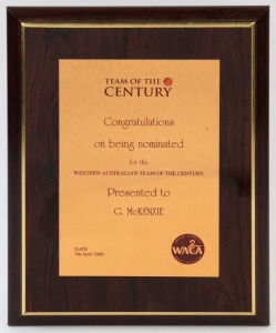 GRAHAM MCKENZIE COLLECTION - WESTERN AUSTRALIAN 'TEAM OF THE CENTURY': 2000 (Apr. 5th) commemorative metal plaque presented to Graham McKenzie on being nominated for inclusion in the 'Western Australian Team of the Century', mounted on wooded base, overall 30x23cm. Very good condition.