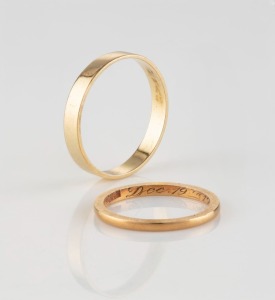 Two yellow gold wedding bands, one dated 1933, 3.7 grams total