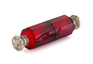 An antique ruby double-ended scent bottle with silver tops, 19th century, 10cm long