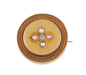 An antique yellow gold circular brooch set with a central diamond surrounded by seed pearls, late 19th century, 3.5cm diameter, 10.7 grams total