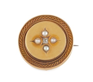 An antique yellow gold circular brooch set with a central diamond surrounded by seed pearls, late 19th century, ​​​​​​​3.5cm diameter, 10.7 grams total