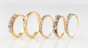 Five vintage and antique 18ct yellow gold rings set with diamonds, early 20th century, all stamped "18ct", 15 grams total
