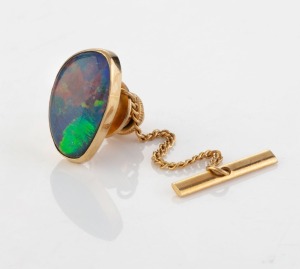 A 9ct yellow gold and opal triplet tie pin, circa 1970, 1.2cm wide. Accompanied by an Opal Gallery of Melbourne valuation for $1,220 