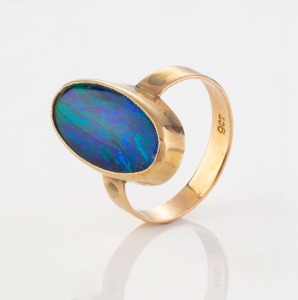 An antique 9ct rose gold ring set with oval blue/green opal, circa 1900, stamped "9ct", 3.5 grams total