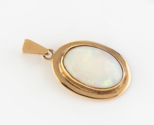 A 9ct yellow gold pendant set with a solid white opal, circa 1970, stamped "375", 2.5cm high overall, 2.4 grams