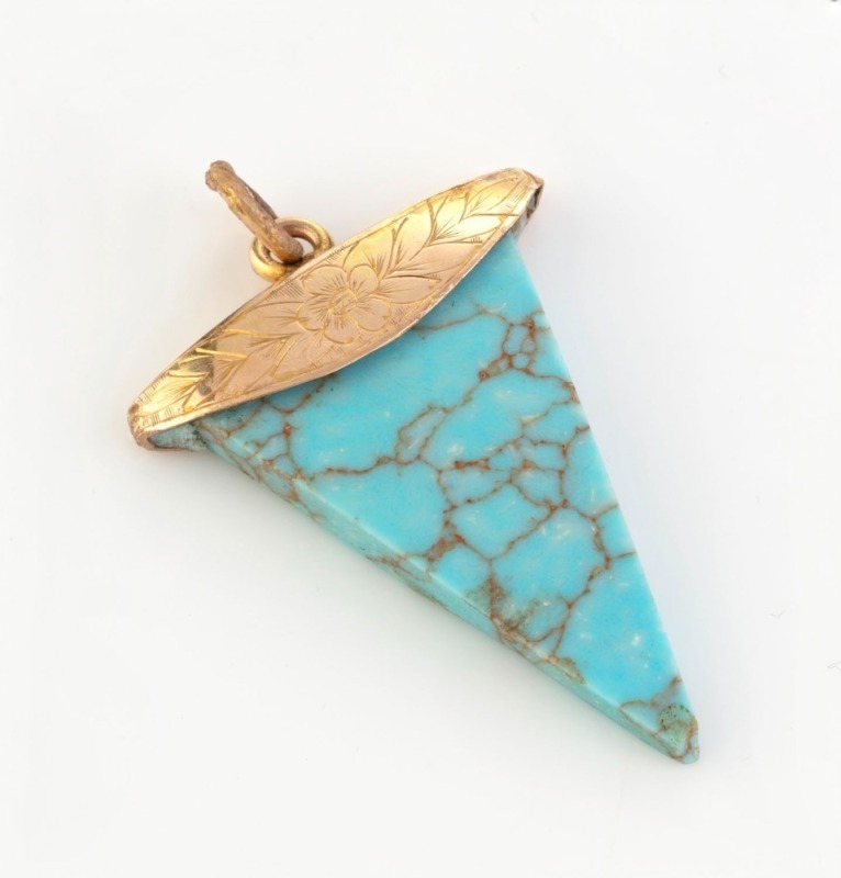 An antique 15ct yellow gold mounted turquoise pendant of tooth form, 19th century, ​​​​​​​4cm high overall