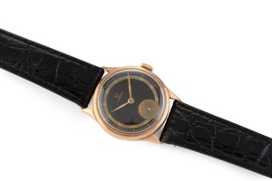 OMEGA boys size rose gold cased manual wristwatch with Roman numerals, subsidiary dial and black face, ​​​​​​​3cm wide including crown