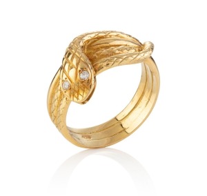An 18ct yellow gold snake ring with diamond set eyes, stamped "750", 13 grams