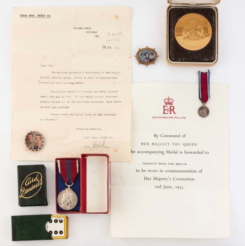 King George V silver jubilee miniature medal with accompanying letter, King George VI coronation badge and brooch, Queen Elizabeth II coronation medal in box with accompanying letter, Royal Australia Mint "CANBERRA AUSTRALIA" gold plated medal (60mm) in c