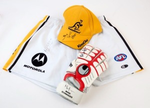 SIGNED MEMORABILIA: with SOCCER: Mark Schwarzer (Australia) signed goalkeeper's glove; AFL FOOTBALL: Nathan Brown signature on Richmond shorts; RUGBY UNION: James Horwill (Australia) on KooGa Wallabies cap. (3 items)