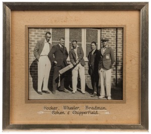 DON BRADMAN - NEW SOUTH WALES: c.late 1920s photograph (15x20cm) of Bradman posing with cricket bat, wearing his NSW blazer, alongside NSW team mates Hal Hooker & Arthur Chipperfield, plus two NSW Cricket association members; framed and glazed using premium conservation materials. Rare.