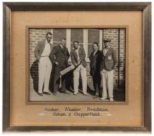 DON BRADMAN - NEW SOUTH WALES: c.late 1920s  photograph (15x20cm) of Bradman posing with cricket bat, wearing his NSW blazer, alongside NSW team mates Hal Hooker & Arthur Chipperfield, plus two NSW Cricket association members; framed and glazed using prem