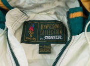 1996 ATLANTA OLYMPICS: 'Atlanta 1996' large sized jacket (with hood) made by 'Starter', in green, white & orange, decorated with a flag design of competing nations; in good condition. - 2