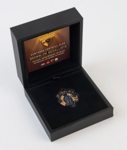 HAWTHORN - REPLICA BROWNLOW MEDAL: commemorative replica Chas Brownlow medal dedicated to Hawthorn Football Club winners of the medal comprising Col Austen (1949), Robert DiPierdomenico (1986), John Platten (1987), Shane Crawford (1999), Sam Mitchell (201