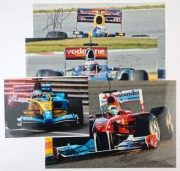 SIGNED DRIVER COLOUR PHOTOGRAPHS: comprising Felippe Massa&nbsp;(Ferrari), Jenson Button (McLaren), Sebastian Vettel (Red Bull), all 30x45cm and Fernando Alonso (Renault) 21x29cm.&nbsp;