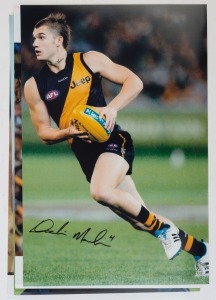 RICHMOND - PLAYER SIGNED COLOUR PRINTS: action images (46x31) of Dustin Martin, Matthew Richardson, Nathan Brown, and Andrew Raines. (4 items)