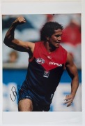 MELBOURNE - PLAYER SIGNED COLOUR PRINTS:&nbsp;action images (46x31) of&nbsp; Aaron Davey, Cameron Bruce and Jack Watts; also a copy of artwork by Paul Harvey showing Ron Barassi, boldly signed by the Demons legend.&nbsp;(4 items)