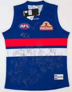 WESTERN BULLDOGS: KooGa guernsey (size L) with approximately 40 signatures from the 2011 squad including Robert Murphy, Mitch Wallis, Daniel Cross, Easton Wood, Adam Cooney & Tom Liberatore,