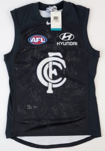 CARLTON: Nike guernsey (size L), signed by numerous 2013 squad members including Mick Malthouse (coach), Chris Judd (capt.), Mark Murphy & Eddie Betts.
