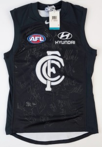 CARLTON: Nike guernsey (size L), signed by numerous 2013 squad members including Mick Malthouse (coach), Chris Judd (capt.), Mark Murphy & Eddie Betts.