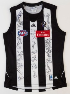 COLLINGWOOD - 2010 PREMIERSHIP YEAR: Adidas guernsey (size L), signed by whole of the 2010 squad including Nick Maxwell (capt.), Dane Swan, Dayne Beams, Luke Ball, Steele Sidebottom & Scott Pendlebury.