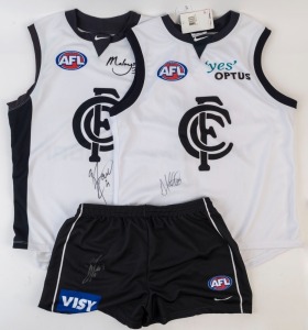 CARLTON: Nike (size XL) shorts and Away team guernsey both signed by Brendan Fevola, plus Nike (size XL) Away team guernsey signed by Anthony Koutoufides. (3 items)