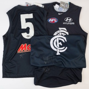 CARLTON: 2013-14 era guernseys (4) comprising Bryce Gibbs (No 4, size M) signed on front & on reverse, Mark Murphy (size L) signed on front, Chris Judd (No 5, Size M) signed on reverse and Dale Thomas (size L), signed on front. (4)