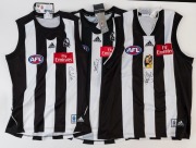 COLLINGWOOD: Adidas 2002 guernsey (size XL) signed by Nathan Buckley (2002 AFL Buckley trading card attached); also Adidas 2010 guernseys (Premiership Year) signed by Alan Didak&nbsp;(size S) or by Dale Thomas (size L). (3)