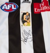 COLLINGWOOD: Adidas 2002 guernsey (size XL) signed by Nathan Buckley (2002 AFL Buckley trading card attached); also Adidas 2010 guernseys (Premiership Year) signed by Alan Didak&nbsp;(size S) or by Dale Thomas (size L). (3) - 2