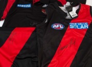 ESSENDON: James Hird&nbsp;signature on Adidas polo/coach's shirt (size L) and on 2013&nbsp;guernsey&nbsp;(size S); also Jobe Watson signature on 2013 guernsey (size XL). (3)