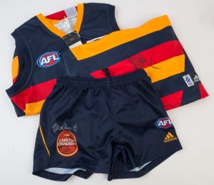 ADELAIDE: Adidas 2004 guernsey (size L) signed by Wayne Carey, 2006 guernsey (size L) and shorts (size M) both signed by Mark Ricciuto. (3 items)