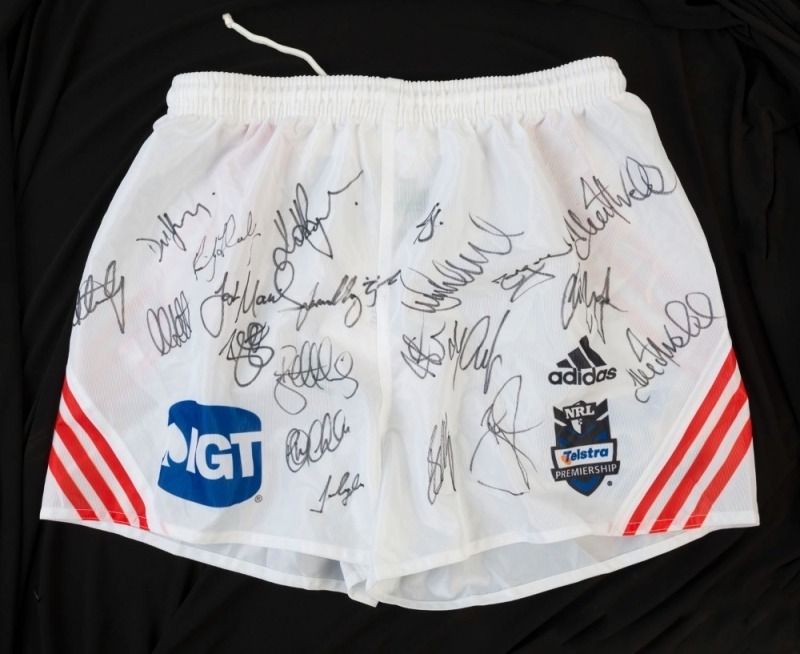 ST GEORGE ILLAWARRA DRAGONS: c.2009 approximately 20 signatures on Dragons NRL shorts (size M) including Wendell Sailor, Brett Morris & Ben Creagh.