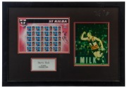 ST KILDA - BARRY HALL: display featuring philatelic stamp sheetlet&nbsp;of 20 stamps each stamp featuring a different St Kilda team member, SIGNED BY HALL, plus an action photo of Hall in his St Kilda&nbsp;team&nbsp;jersey;&nbsp;framed & glazed, overall 49x70cm. Australian S