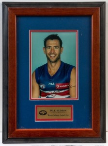 WESTERN BULLDOGS - PAUL HUDSON: display featuring SIGNED colour photograph (20x13cm) of Hudson, framed & glazed, overall 42x31cm. Undated Australian Sports Management CofA.