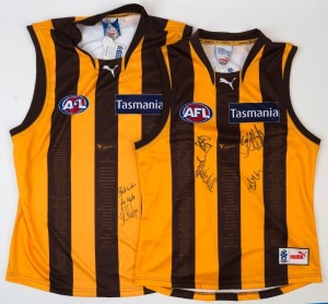 HAWTHORN: 'Celebrating 5 Decades of Flags' guernseys (2, L & 3XL) the former signed by Alastair Clarkson (Coach), Luke Hodge (Capt.), Sam Mitchell & Lance Franklin, the latter signed by Luke Hodge alone. (2)