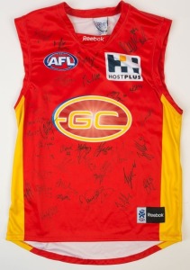 GOLD COAST -  2011 INAUGURAL YEAR  Reebok guernsey (size L), numerous signatures including Gary Ablett Jr, Nathan Bock, Charlie Dixon  Campbell Brown & Jarrod Harbrow.
