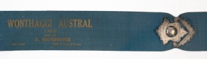 1926 WONTHAGGI 'AUSTRAL' BICYCLE RACE: Winner's sash with metallic braided tassels and sterling silver armorial buckle, total buckle weight, 40gr.