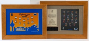 2000 SYDNEY OLYMPICS: Set of 10 'Sydney 2000' commemorative pin badges, limited edition #2018 of 5000, plus set of 16 'Torch Relay' pin badges, limited edition #193 of 2500; both items framed & glazed, 34x44cm and 37x47cm respectively. (2)